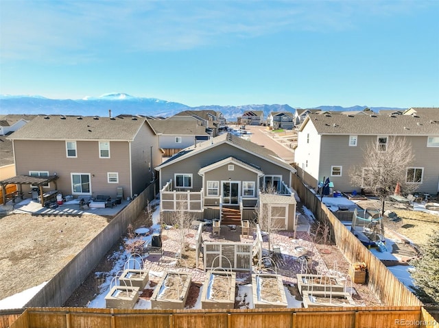 back of house featuring a mountain view