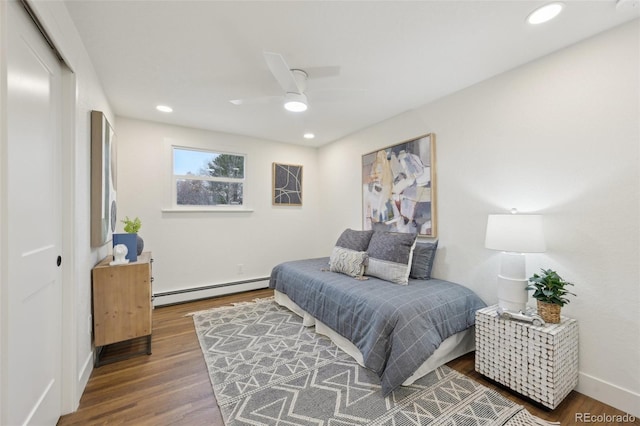 bedroom featuring baseboards, ceiling fan, wood finished floors, a baseboard heating unit, and recessed lighting