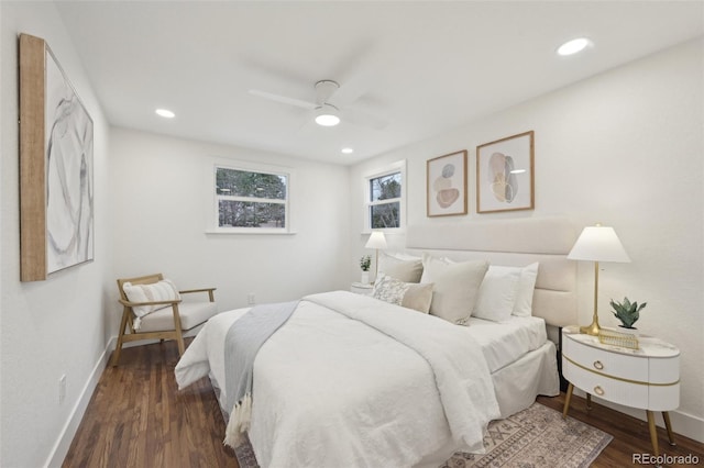 bedroom with baseboards, wood finished floors, and recessed lighting