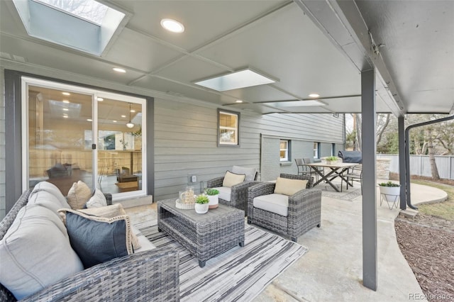 view of patio / terrace with outdoor dining area, fence, and an outdoor living space