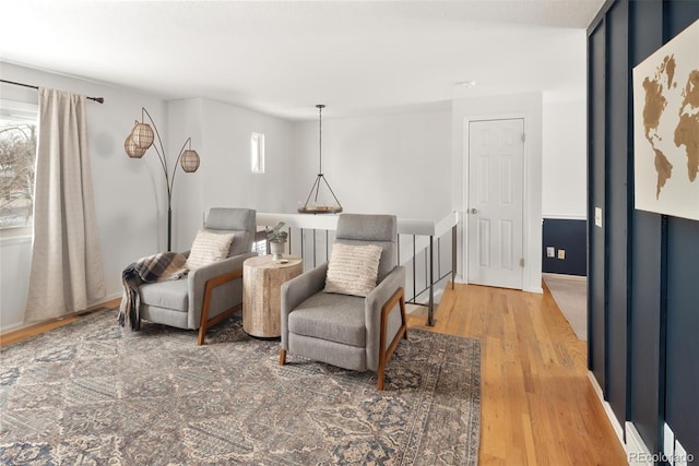 sitting room featuring hardwood / wood-style floors