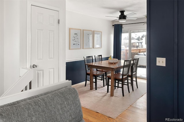 dining room with hardwood / wood-style floors and ceiling fan