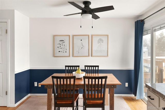 dining space featuring ceiling fan and light hardwood / wood-style floors