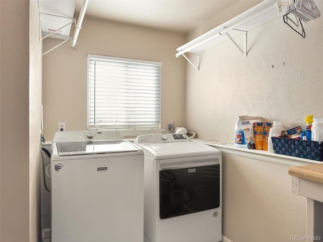 laundry room with washing machine and clothes dryer