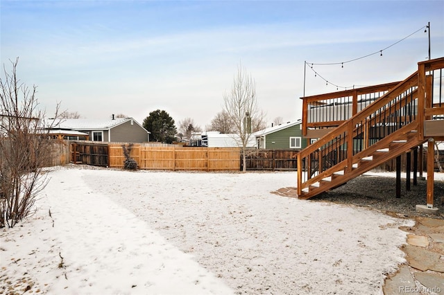 view of yard layered in snow