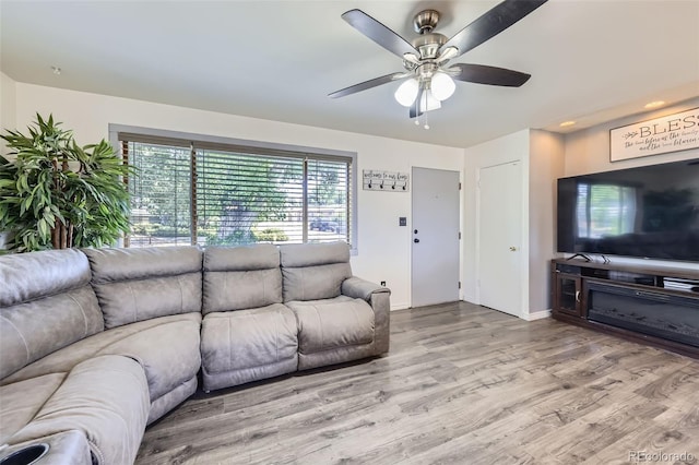 1166 W 98th Ave, Northglenn, CO 80260 - living area featuring a ceiling fan and wood finished floors