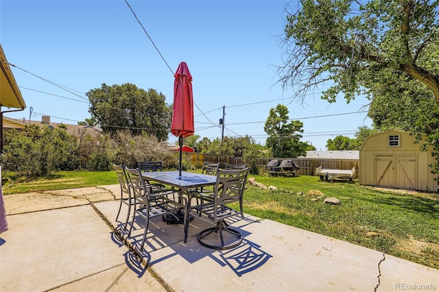 1166 W 98th Ave, Northglenn, CO 80260 - view of patio with a storage shed and outdoor dining space