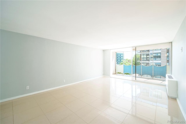 spare room with light tile patterned floors