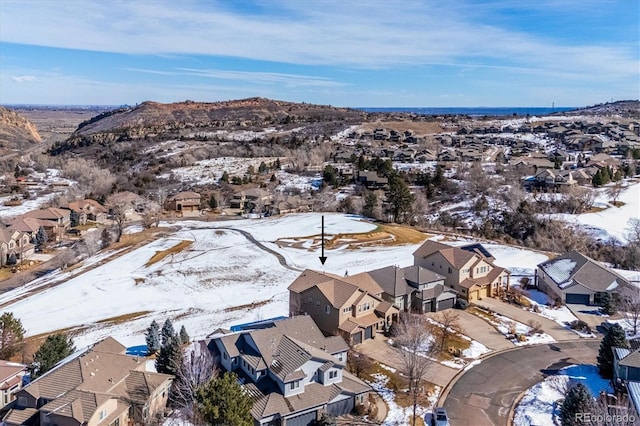 snowy aerial view with a residential view