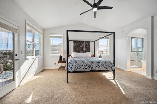 bedroom featuring visible vents, arched walkways, light colored carpet, lofted ceiling, and access to outside