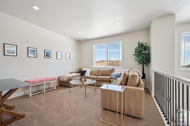 living area featuring baseboards, carpet flooring, and recessed lighting