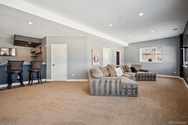 carpeted living room featuring a bar, recessed lighting, visible vents, and baseboards