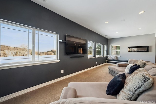 living area featuring lofted ceiling, carpet, baseboards, and recessed lighting