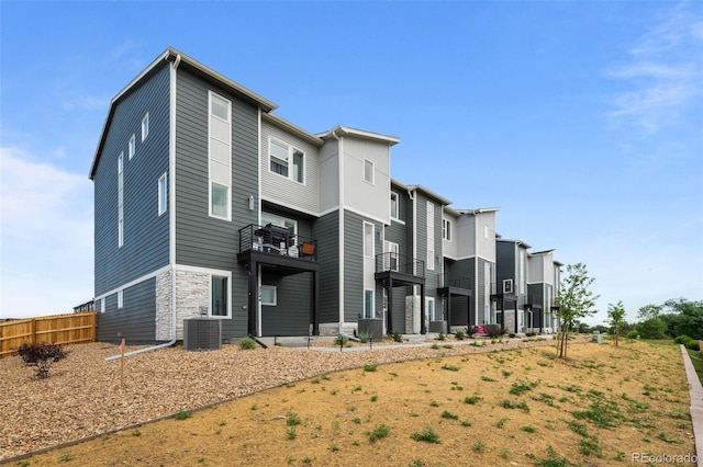 2740 W 68th Ave, Denver, CO 80221 - back of property featuring stone siding and a balcony