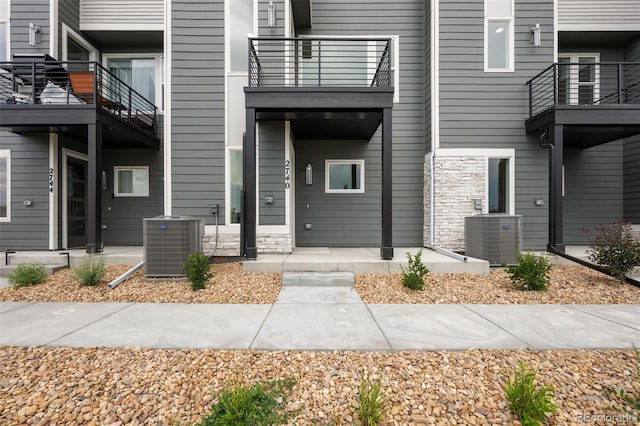 2740 W 68th Ave, Denver, CO 80221 - entrance to property featuring a balcony and stone siding