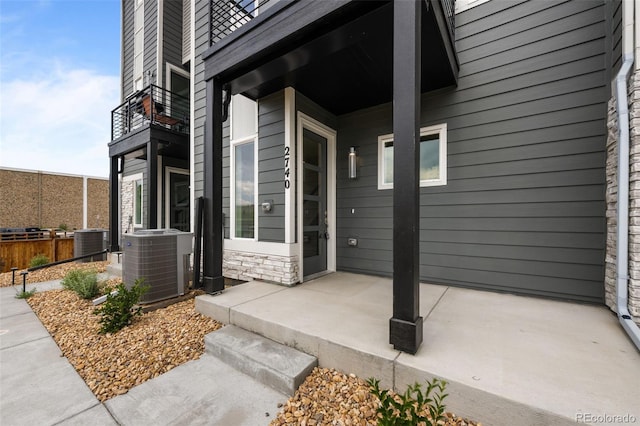2740 W 68th Ave, Denver, CO 80221 - doorway to property featuring a balcony and stone siding