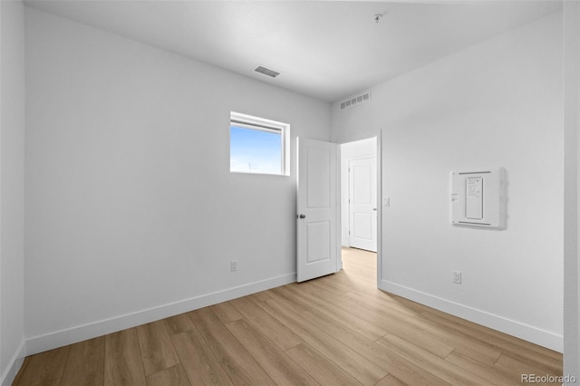 2740 W 68th Ave, Denver, CO 80221 - empty room with light wood-type flooring and fire sprinkler in ceiling