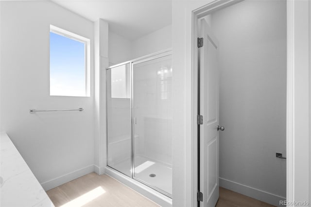 2740 W 68th Ave, Denver, CO 80221 - bathroom featuring a shower stall and baseboards