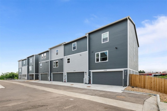 2740 W 68th Ave, Denver, CO 80221 - back of house featuring an attached garage