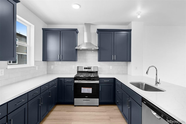 2740 W 68th Ave, Denver, CO 80221 - kitchen with appliances with stainless steel finishes, wall chimney range hood, tasteful backsplash, light wood finished floors, and light stone counters