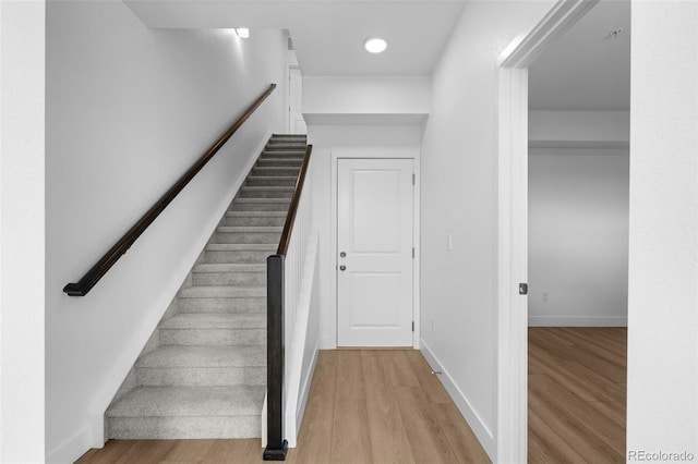2740 W 68th Ave, Denver, CO 80221 - staircase featuring wood finished floors and recessed lighting