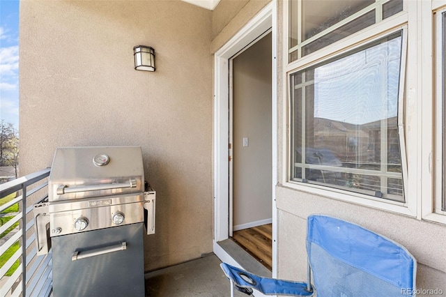 view of patio / terrace featuring area for grilling and a balcony
