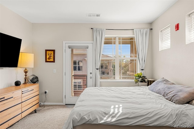bedroom featuring visible vents, baseboards, access to outside, and light carpet