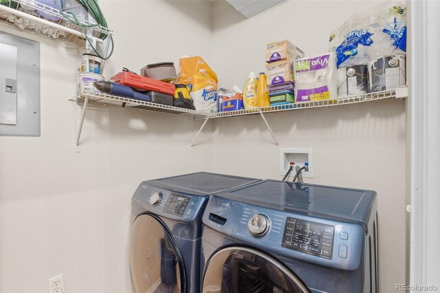 laundry area featuring washing machine and clothes dryer, laundry area, and electric panel