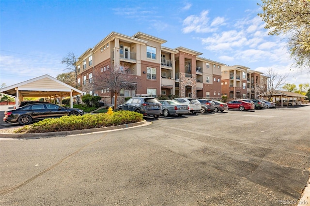 view of property featuring uncovered parking