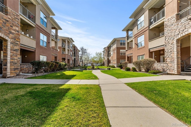 view of community with a residential view and a lawn