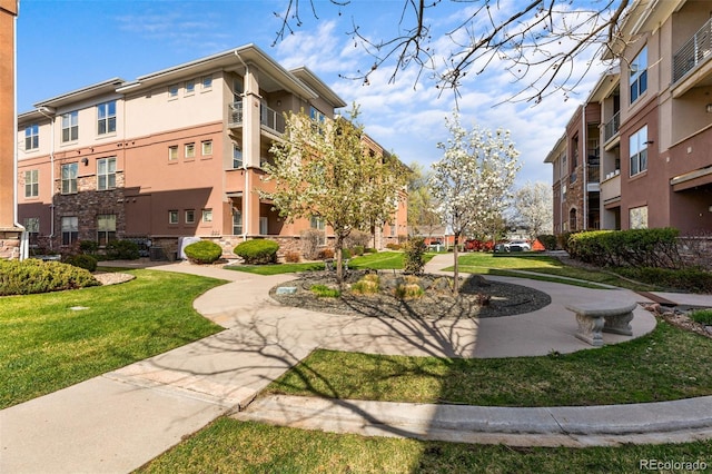 surrounding community featuring a lawn