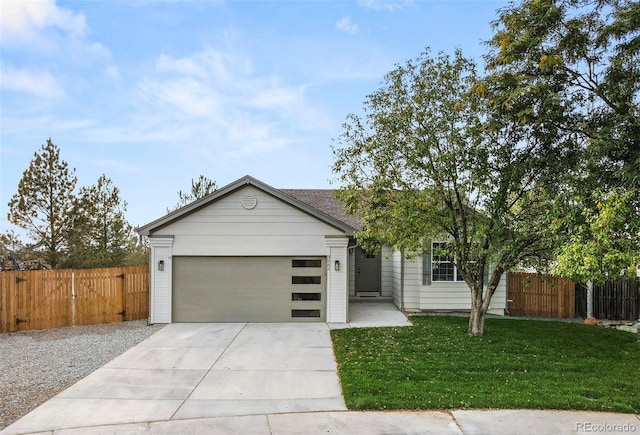 view of front of house featuring a front yard and a garage