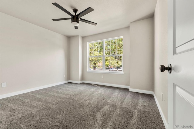 spare room with ceiling fan and carpet flooring