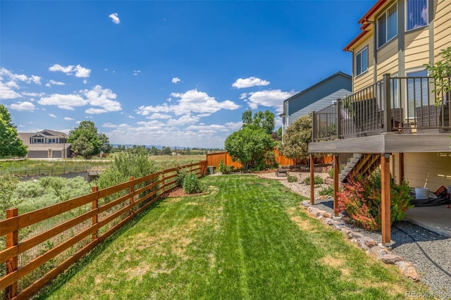 5168 Rocky Mountain Dr, Castle Rock, CO 80109 - fenced backyard featuring a deck, stairway, and a patio