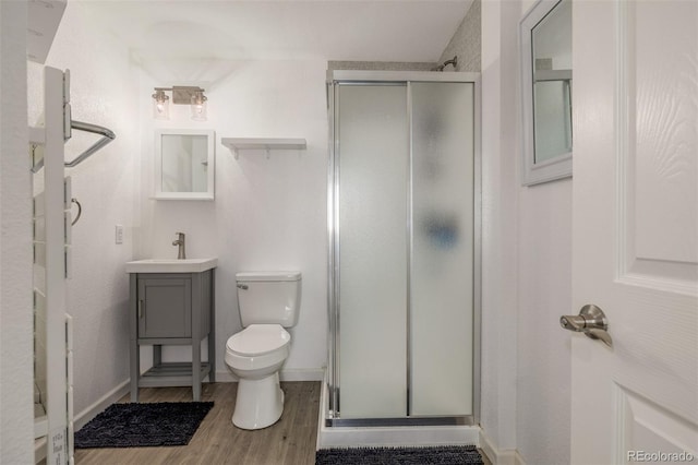 5168 Rocky Mountain Dr, Castle Rock, CO 80109 - bathroom featuring a stall shower, vanity, and wood finished floors