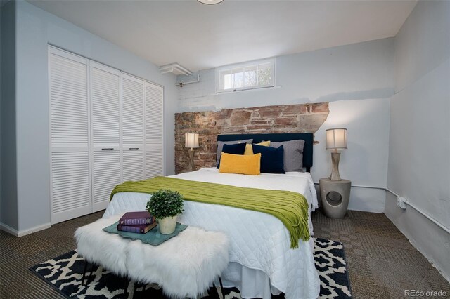 bedroom featuring a closet, carpet flooring, and baseboards