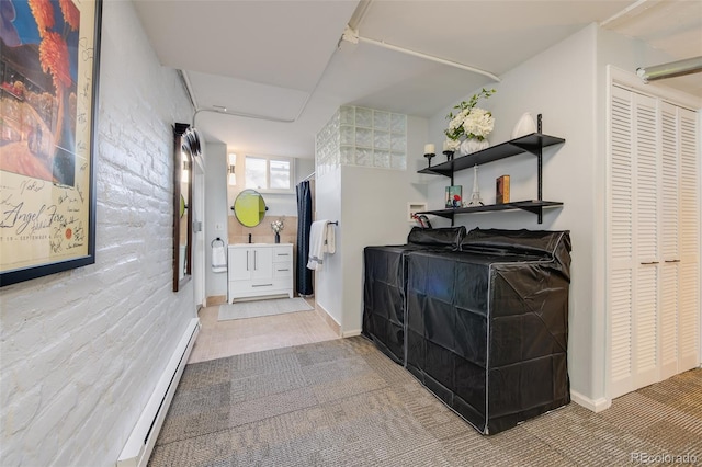 corridor featuring baseboard heating and baseboards