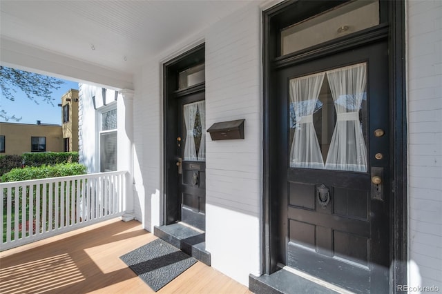 doorway to property featuring a porch
