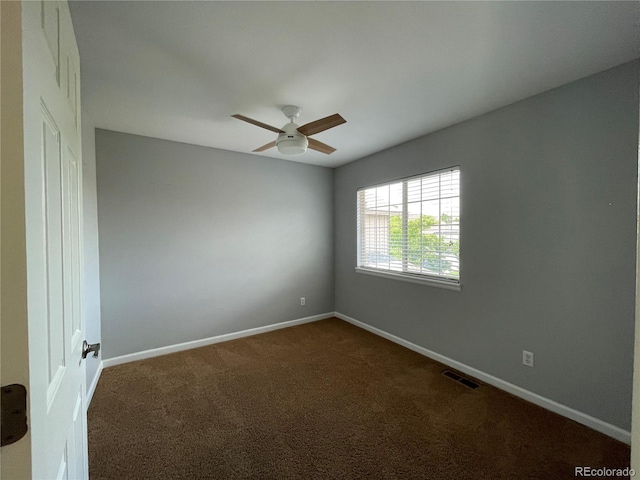 carpeted empty room with ceiling fan