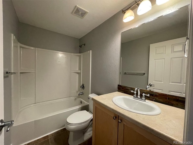 full bathroom featuring tile patterned flooring, vanity, shower / bathtub combination, and toilet