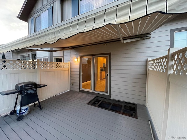 wooden terrace with grilling area