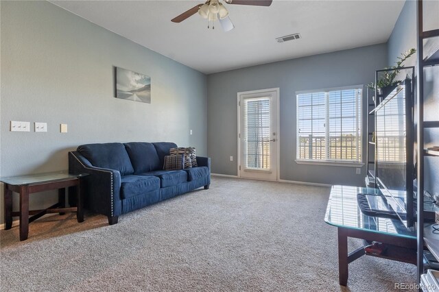 2682 S Cathay Way Unit 307, Aurora, CO 80013 - living room featuring carpet flooring, a ceiling fan, and baseboards