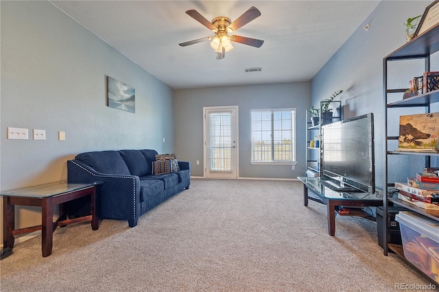 2682 S Cathay Way Unit 307, Aurora, CO 80013 - carpeted living area with ceiling fan and baseboards