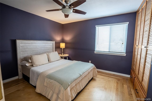 bedroom featuring ceiling fan and a closet