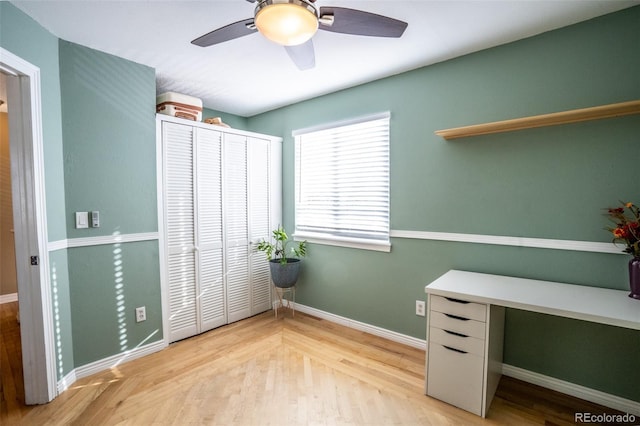 interior space featuring ceiling fan, a closet, and light hardwood / wood-style floors