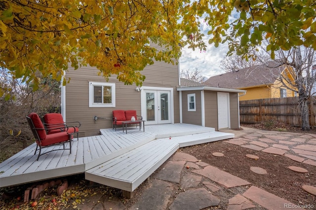 rear view of property featuring a deck