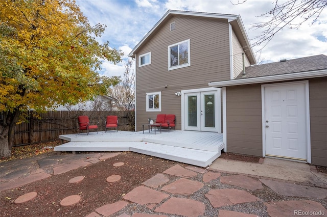 back of property featuring french doors and a deck