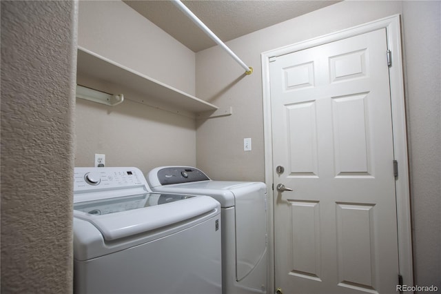 clothes washing area featuring independent washer and dryer