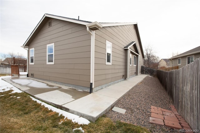 view of property exterior with a patio