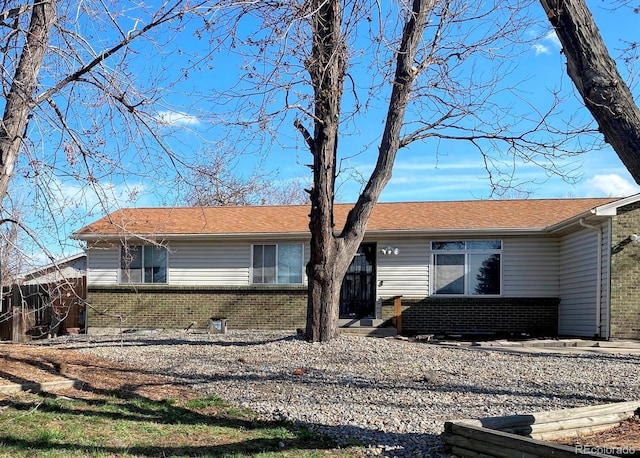 3190 S Joplin Ct, Aurora, CO 80013 - view of front facade with brick siding and fence